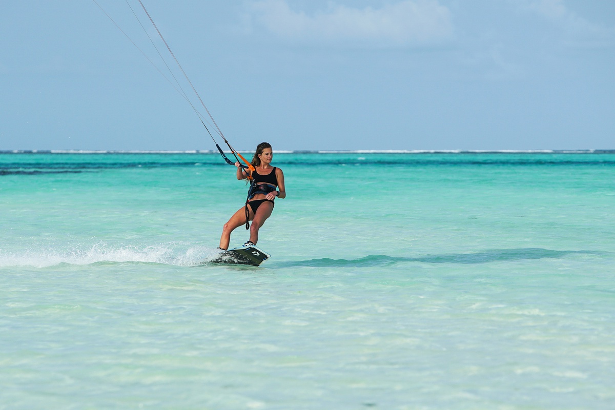 Kitesurfing girl on Zanzibar island
